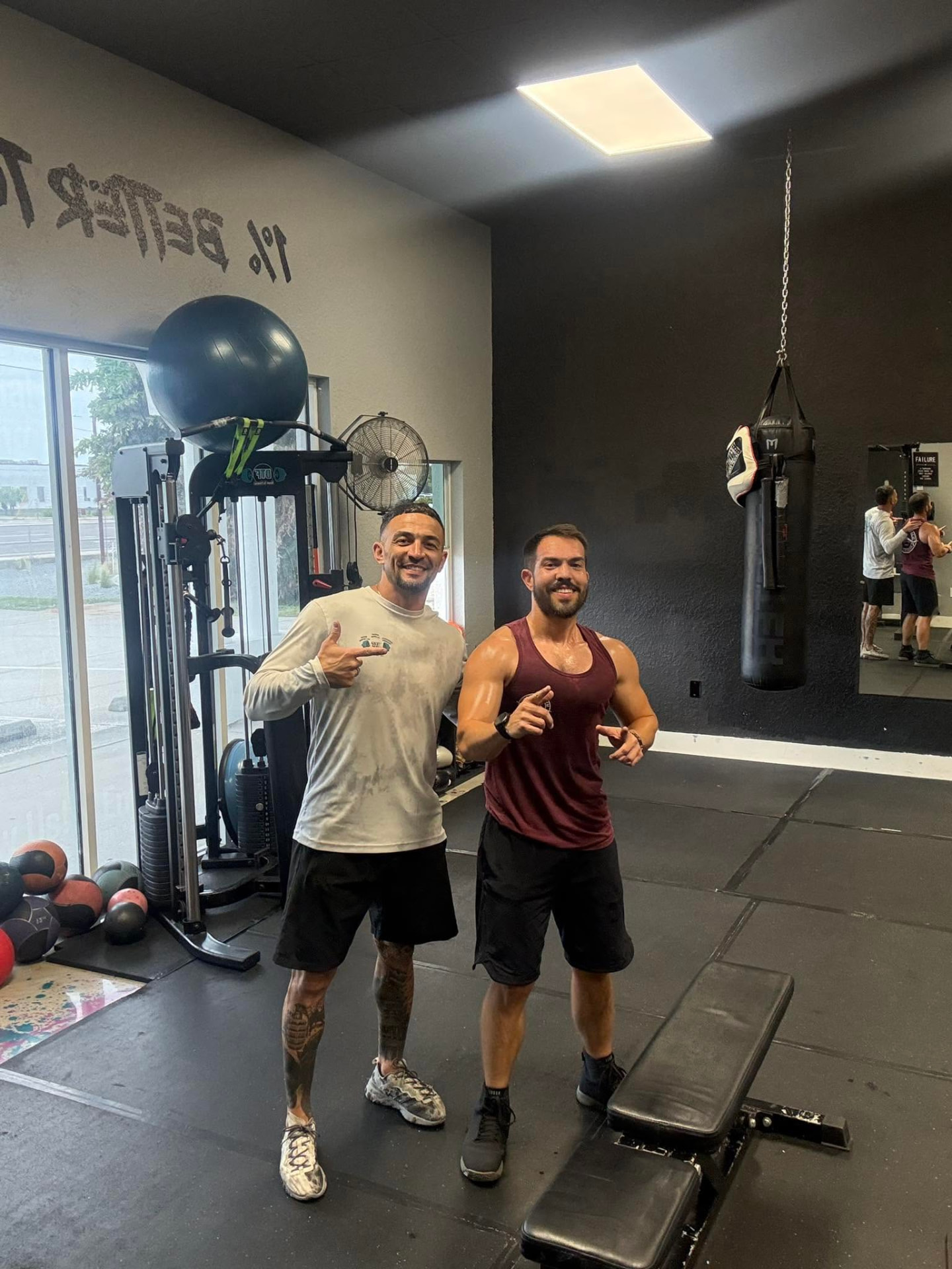 Coach Jeremy with a member on the DTF training floor
