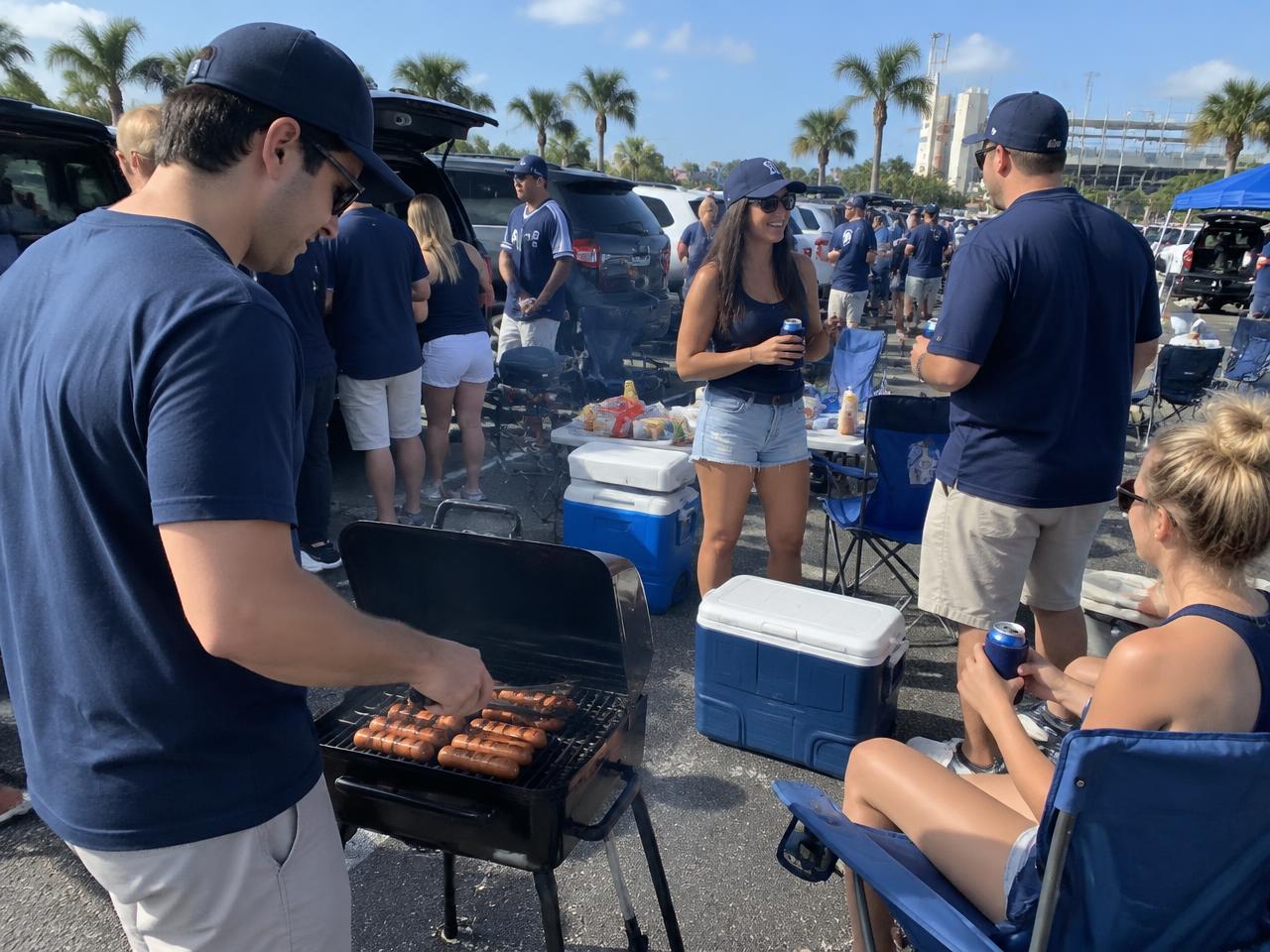Ballpark tailgate with grill, coolers and chairs